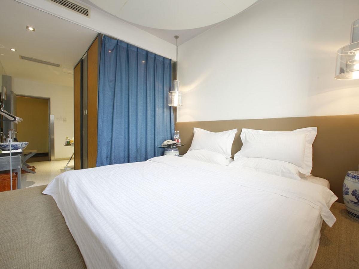 China Community Art Habitat Hotel Qingdao Quarto foto
